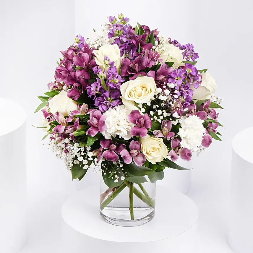 Purple and White Floral Bunch In Glass Vase: Flowers Delivery Ras Al Khaimah